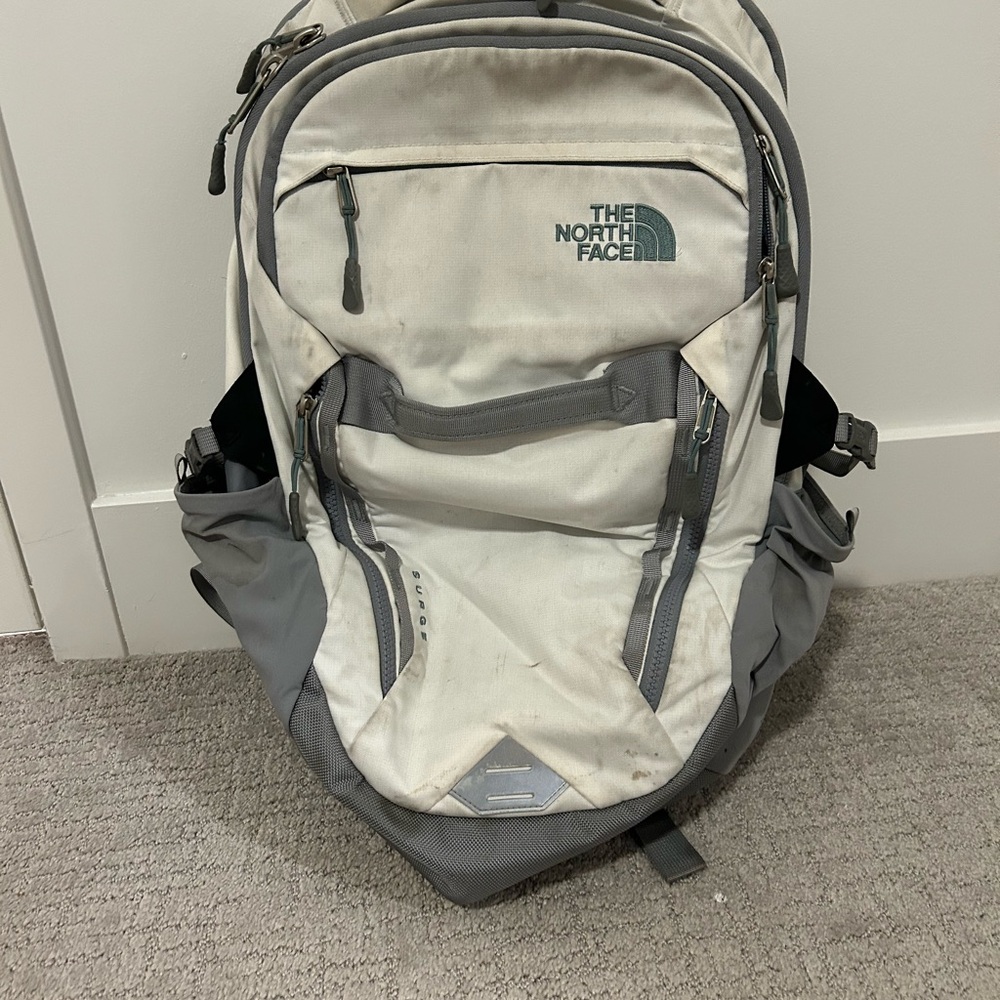 The North Face Gray Backpack with Spacious Compartments and Compression Straps